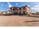 Two-story house with stucco exterior, large windows, and a porte-cochere, plus a three car garage at 8315 E Palm Ln, Mesa, AZ 85207