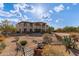 Landscaped front yard with a fire pit and a bench, in front of a two story house at 8315 E Palm Ln, Mesa, AZ 85207