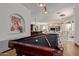 Elegant game room showcasing a billiard table and views into the adjacent living area at 8315 E Palm Ln, Mesa, AZ 85207