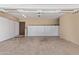 Spacious garage with built-in storage cabinets and epoxy floor at 8315 E Palm Ln, Mesa, AZ 85207