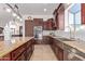 Gourmet kitchen with stainless steel appliances and granite countertops at 8315 E Palm Ln, Mesa, AZ 85207