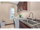 Bright laundry room with washer, dryer, and ample cabinetry at 8315 E Palm Ln, Mesa, AZ 85207