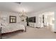Spacious main bedroom with a large bed, plenty of closet space, and a TV at 8315 E Palm Ln, Mesa, AZ 85207