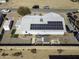 Home with solar panels, backyard patio, and spacious yard at 8547 W Magnum Dr, Arizona City, AZ 85123