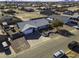 House with a gray roof, landscaping, and a long driveway at 8547 W Magnum Dr, Arizona City, AZ 85123