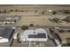 Aerial view of house showcasing solar panels and spacious backyard at 8547 W Magnum Dr, Arizona City, AZ 85123