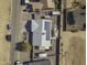 Aerial view of a house with solar panels and a backyard patio at 8547 W Magnum Dr, Arizona City, AZ 85123