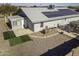 Aerial view of house featuring solar panels and backyard landscaping at 8547 W Magnum Dr, Arizona City, AZ 85123