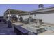 Relaxing backyard patio with fire pit, pergola, and seating area at 8547 W Magnum Dr, Arizona City, AZ 85123
