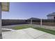 Landscaped backyard with gravel, grass, and a concrete patio at 8547 W Magnum Dr, Arizona City, AZ 85123