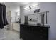 Modern bathroom with double vanity and walk in closet at 8547 W Magnum Dr, Arizona City, AZ 85123