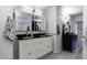 Elegant bathroom with double vanity and a large mirror at 8547 W Magnum Dr, Arizona City, AZ 85123