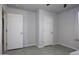 Simple bedroom with two closets and neutral walls at 8547 W Magnum Dr, Arizona City, AZ 85123