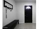 Interior entryway with bench, mirror, and coat rack at 8547 W Magnum Dr, Arizona City, AZ 85123