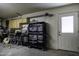 Organized garage workshop with ample storage and workbenches at 8547 W Magnum Dr, Arizona City, AZ 85123