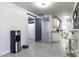 Clean and modern hallway with barn door, leading to laundry and kitchen at 8547 W Magnum Dr, Arizona City, AZ 85123