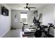 Home gym with various exercise equipment including a stationary bike at 8547 W Magnum Dr, Arizona City, AZ 85123