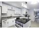 Modern kitchen with white shaker cabinets, granite countertops, and kitchen island at 8547 W Magnum Dr, Arizona City, AZ 85123