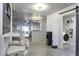 Small laundry room with washer and dryer, located off the kitchen at 8547 W Magnum Dr, Arizona City, AZ 85123