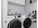 Convenient laundry room with washer, dryer, and cabinets at 8547 W Magnum Dr, Arizona City, AZ 85123