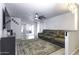 Spacious living room with gray sectional sofa and fireplace at 8547 W Magnum Dr, Arizona City, AZ 85123