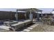 Backyard patio with a pergola, fire pit, and seating area at 8547 W Magnum Dr, Arizona City, AZ 85123