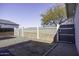 Landscaped side yard with gravel and a gated entrance at 8547 W Magnum Dr, Arizona City, AZ 85123