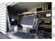 Outdoor storage container with shelving for various items at 8547 W Magnum Dr, Arizona City, AZ 85123
