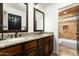 Bathroom with double sinks and granite countertops at 10484 E Mission Ln, Scottsdale, AZ 85258