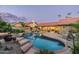 Inviting kidney-shaped pool with brick coping and spa at 10484 E Mission Ln, Scottsdale, AZ 85258