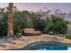 Relaxing poolside seating area with fire pit at 10484 E Mission Ln, Scottsdale, AZ 85258