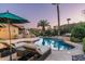 Luxury pool with patio furniture and fire feature at 10484 E Mission Ln, Scottsdale, AZ 85258