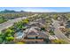 Aerial view of a house with a pool and solar panels in a mountain setting at 11453 E Mark Ln, Scottsdale, AZ 85262