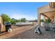 Landscaped backyard with grill, patio furniture and expansive desert views at 11453 E Mark Ln, Scottsdale, AZ 85262