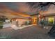 Desert landscape surrounds this single-story home with a two-car garage at 11453 E Mark Ln, Scottsdale, AZ 85262