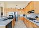 Modern kitchen featuring stainless steel appliances and light wood cabinets at 11453 E Mark Ln, Scottsdale, AZ 85262