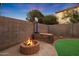 Fire pit and basketball court in backyard at 1174 E Canyon Creek Dr, Gilbert, AZ 85295