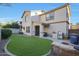 Large backyard with grassy lawn, fire pit, and built-in grill at 1174 E Canyon Creek Dr, Gilbert, AZ 85295