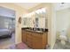 Double vanity bathroom with granite countertops and ample storage at 1174 E Canyon Creek Dr, Gilbert, AZ 85295