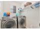 Laundry room with washer and dryer, and additional shelving at 1174 E Canyon Creek Dr, Gilbert, AZ 85295