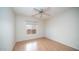 Simple bedroom with wood flooring and ceiling fan at 1274 N Ithica St, Gilbert, AZ 85233