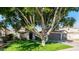 House exterior with two-car garage and large tree at 1274 N Ithica St, Gilbert, AZ 85233