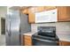 Stainless steel appliances and wood cabinets at 1274 N Ithica St, Gilbert, AZ 85233