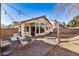 Backyard patio with seating area and view of house at 12810 W Edgemont Ave, Avondale, AZ 85392