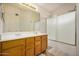 Bathroom with double sinks and a shower/tub combo at 12810 W Edgemont Ave, Avondale, AZ 85392