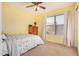 Cozy bedroom featuring a floral bedspread and window blinds at 12810 W Edgemont Ave, Avondale, AZ 85392