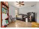 Charming Bedroom featuring a crib, dresser, and bookcase at 12810 W Edgemont Ave, Avondale, AZ 85392