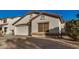 Single-story house with a two-car garage and desert landscaping at 12810 W Edgemont Ave, Avondale, AZ 85392