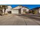 House exterior with a driveway and desert landscaping at 12810 W Edgemont Ave, Avondale, AZ 85392