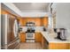 Kitchen with stainless steel appliances and wood cabinets at 12810 W Edgemont Ave, Avondale, AZ 85392